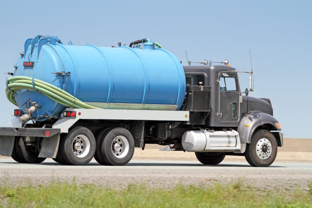 Septic Tank Pump Truck On Highway, Side View